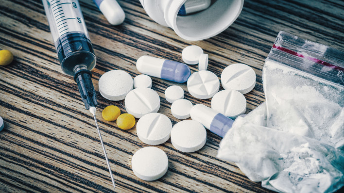 syringe and pills