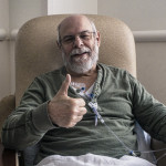 old man with beard giving thumbs up chemo therapy treatment