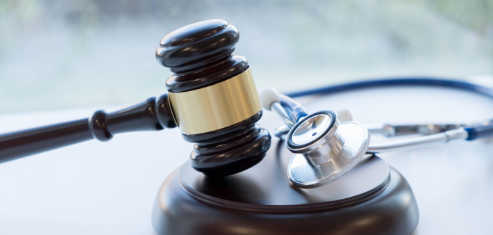 Gavel and stethoscope. medical jurisprudence. legal definition of medical malpractice. attorney. common errors doctors, nurses and hospitals make