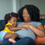 pregnant mother and young girl