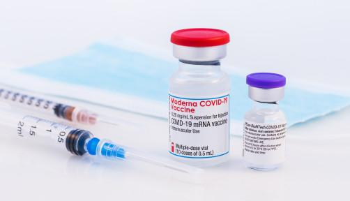 Pfizer BioNTech and Moderna Covid-19 vaccine on a white background.
