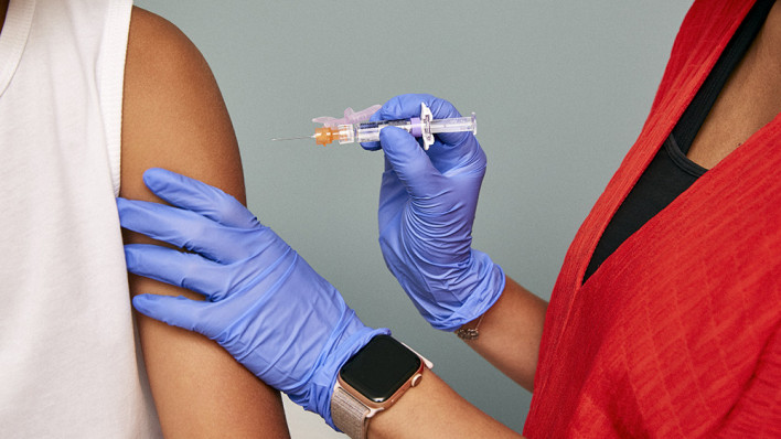 a vaccine is injected into arm