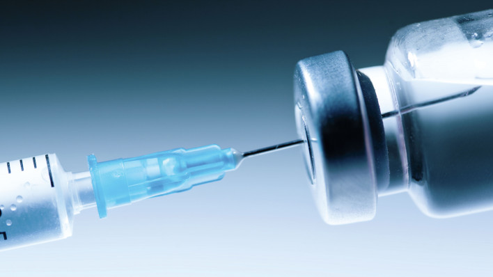 Medical syringe with a needle and a bollte with vaccine