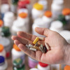hand holding vitamins and supplements