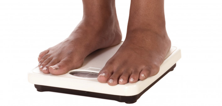 standing on scale weight