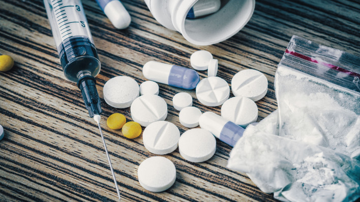syringe and pills