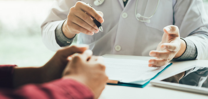 Doctor talking to the patient about menopause and treatment in future.