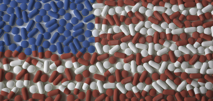 Medicated United States. An American flag made from red, white, and blue pills. US Healthcare reform background concept.