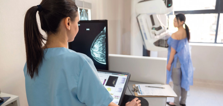 mammogram tech and patient