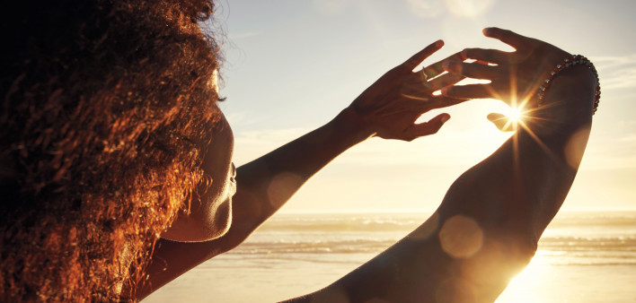 woman sun rise hands out happy