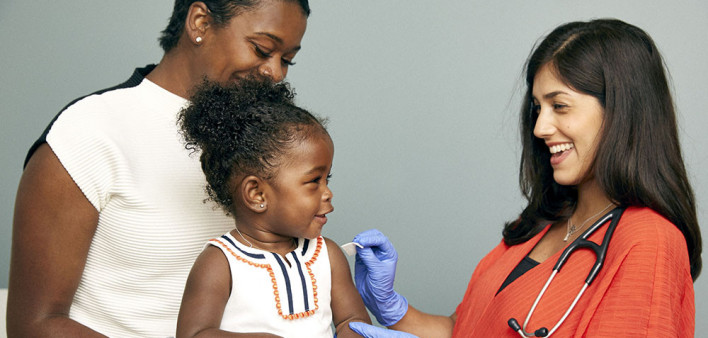 little girl and mother vaccine