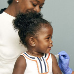 little girl and mother vaccine