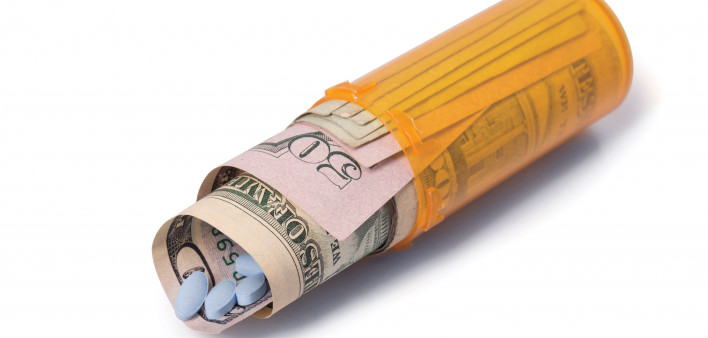 blue pills money pill bottle healthcare cost