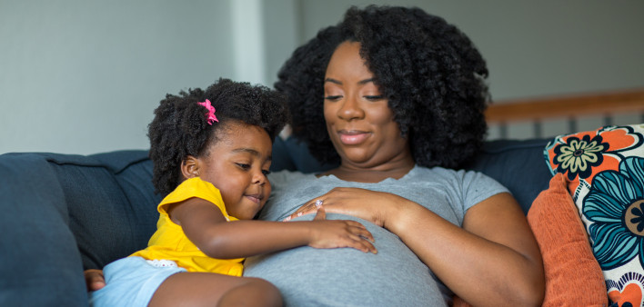 pregnant mother and young girl
