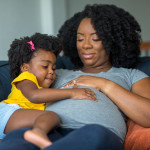 pregnant mother and young girl