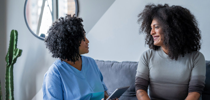 two women talking and laughing