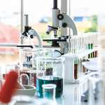 beakers and microscopes in laboratory