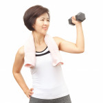 Asian woman lifting a weight exercise
