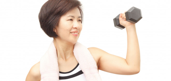 Asian woman lifting a weight exercise