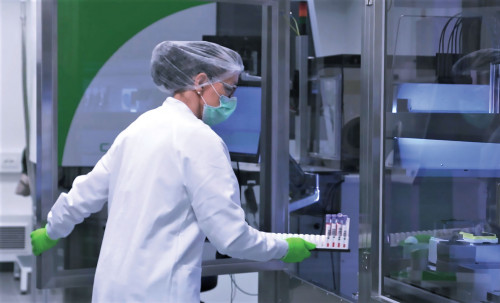 A laboratory worker receives patient tumor samples at BioNTech’s facility in Germany.