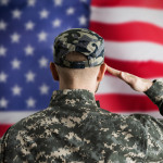 Military US Soldier Saluting Flag. Army Veteran