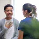 young woman taking to her doctor