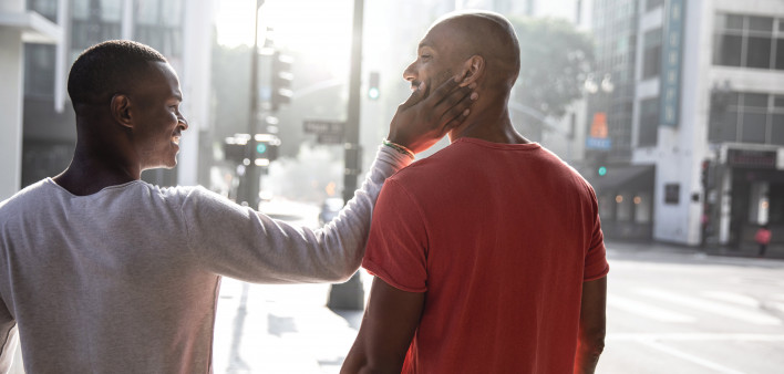 black gay couple embrace