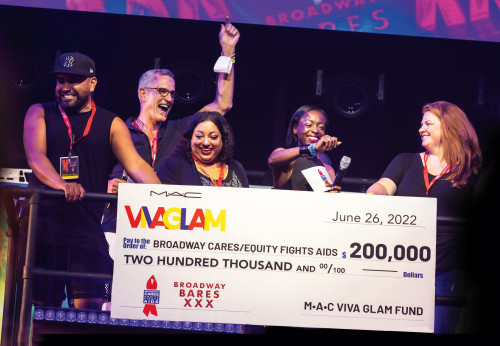 Broadway Bares creator and producer Jerry Mitchell accepts a $200,000 donation to BC/EFA from the MAC Viva Glam Fund