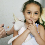 girl receiving a vaccine