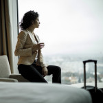 Businesswoman relaxing in a hotel room