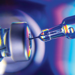 needle going into vial vaccine