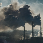 Ecological catastrophy smokestacks billowing smoke