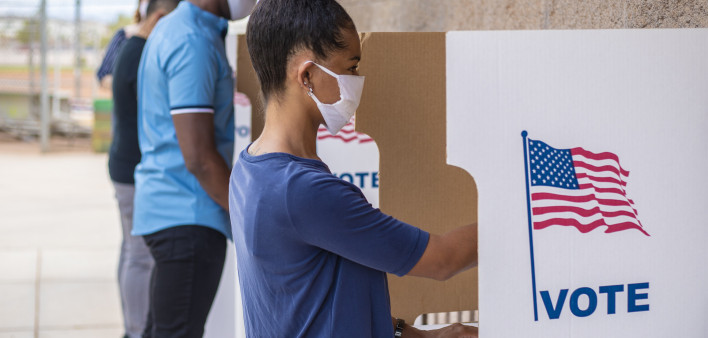 Waiting in line and voting.