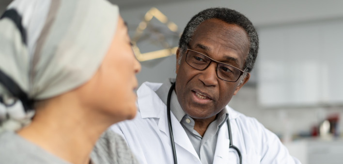 Physician consults cancer patient