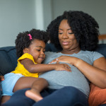 pregnant mother and young girl