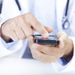  a doctor touching a smart phone