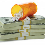 cost of healthcare bottle of pills on money