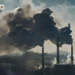 Ecological catastrophy smokestacks billowing smoke