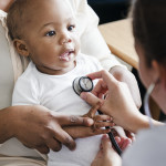 baby and doctor stethoscope