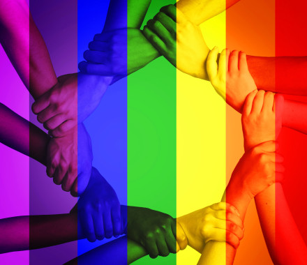 Cropped shot of unrecognizable people linking arms against a multi colored overlay