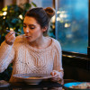 Beautiful girl having dinner at cafe - Stock image Restaurant, Ukraine, Soup, Eating, Women