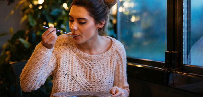 Beautiful girl having dinner at cafe - Stock image Restaurant, Ukraine, Soup, Eating, Women