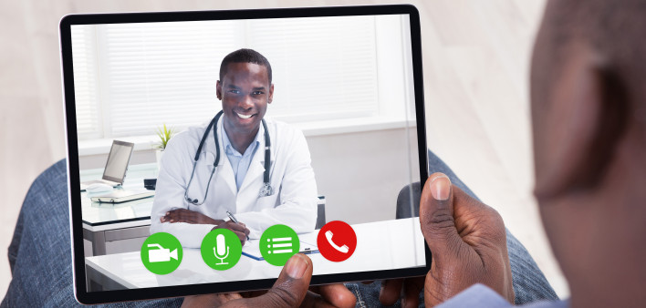 Close-up Of African Person Holding Blank Digital Tablet