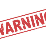 Stamp warning with red text on white