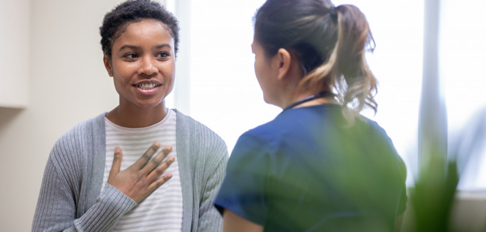 young woman taking to her doctor