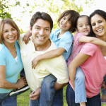 A multi-generational latin family having fun outdoors