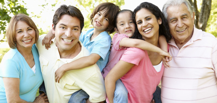 A multi-generational latin family having fun outdoors
