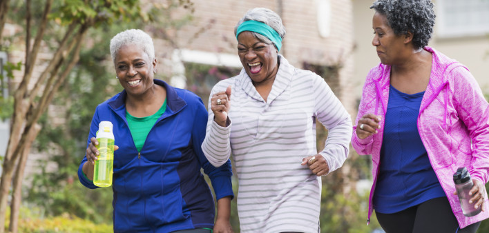 Three senior black women exercising together