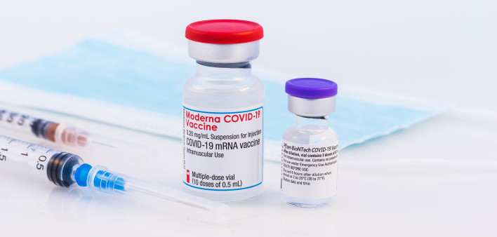 Pfizer BioNTech and Moderna Covid-19 vaccine on a white background.