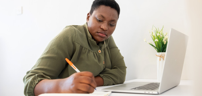 Nairobi Healthy woman living with HIV working on a laptop